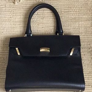 Calvin Klein Brook top handles black pebble leather satchel bag.